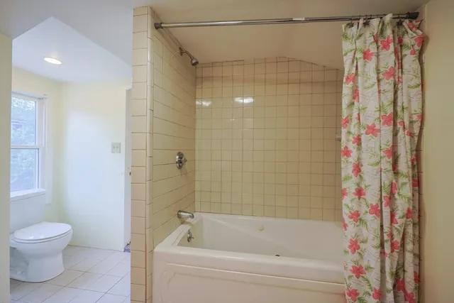 a view of a kitchen with wooden floor and electronic appliances