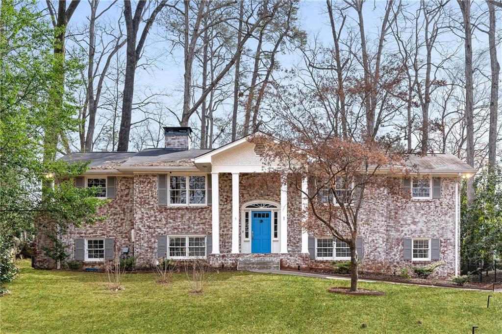 front view of a house with a yard