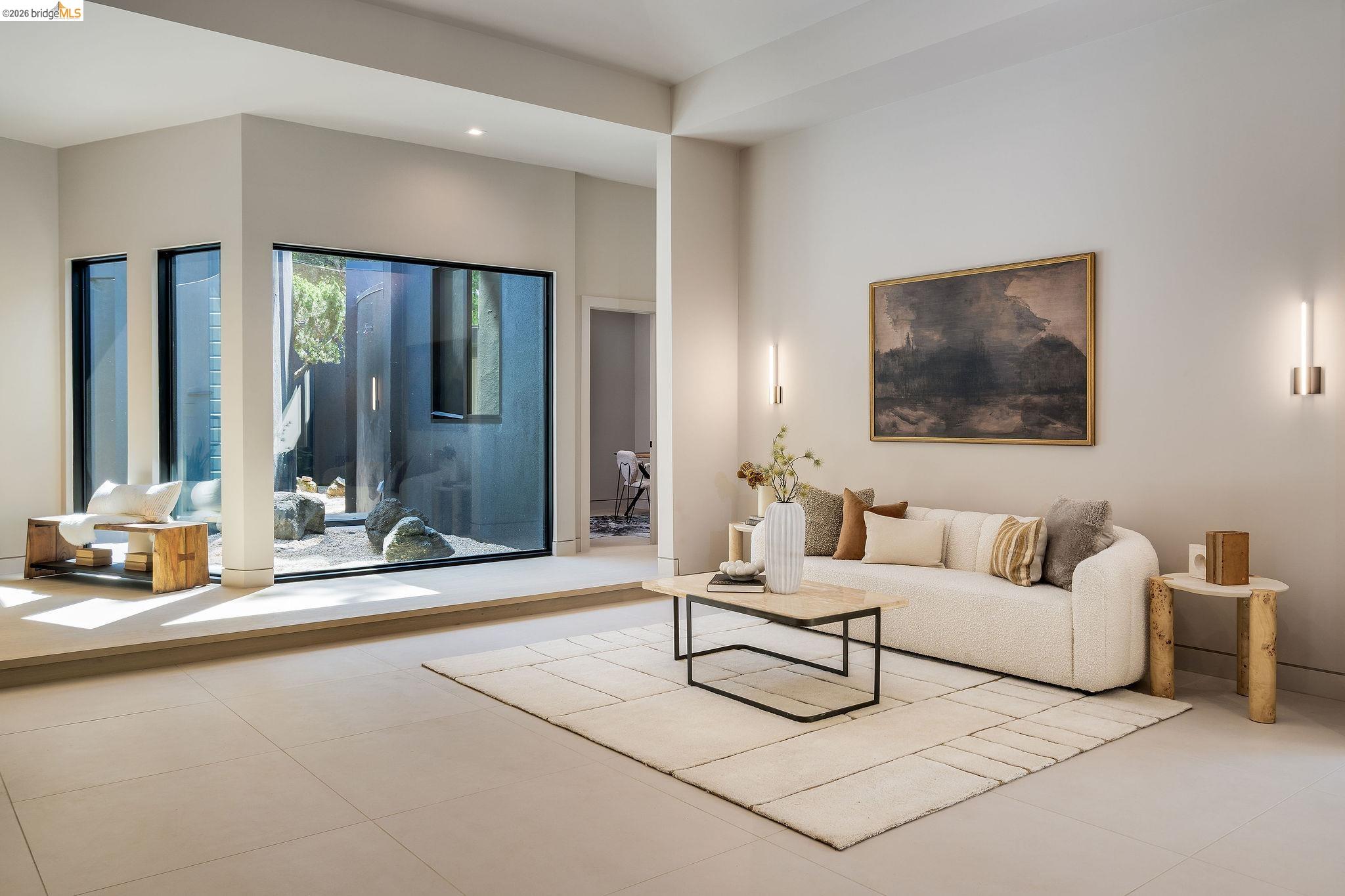 5645 Bacon Road Oakland, CA 94619 - Photo 10 of 94 Spacious living area featuring large format tile flooring and a minimalist aesthetic