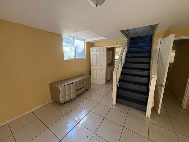 a view of entryway with stairs and wooden floor