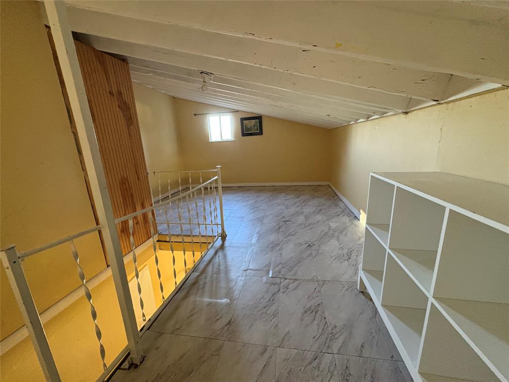 45 Northeast 146th Street, Unit B Miami, FL 33161 - Photo 14 of 16 a view of an empty room with wooden floor