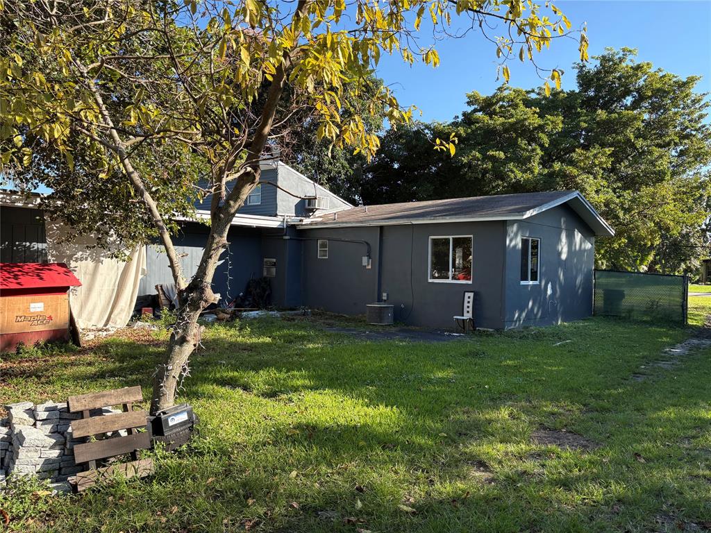45 Northeast 146th Street, Unit B Miami, FL 33161 - Photo 3 of 16 a front view of a house with garden