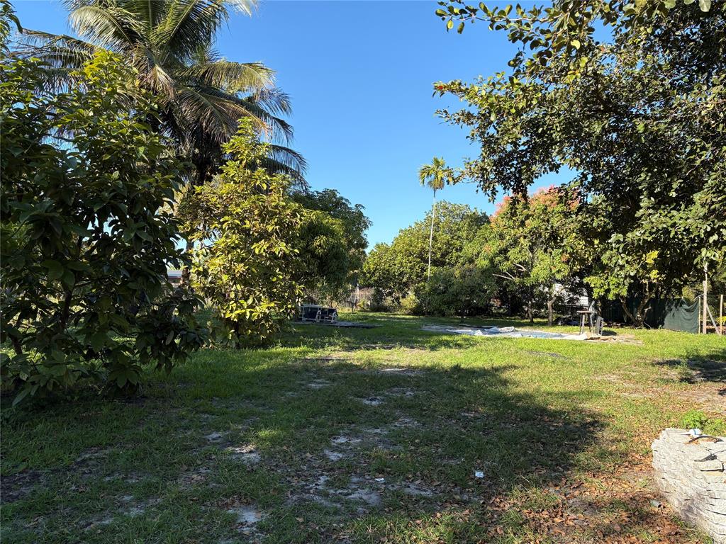 45 Northeast 146th Street, Unit B Miami, FL 33161 - Photo 4 of 16 a view of a golf course with a trees