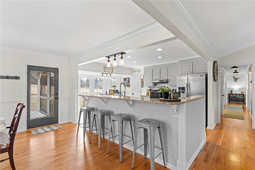 200 Poore Road Piedmont, SC 29673 - Photo 11 of 44 This bright kitchen features an expansive island and seamless flow, perfect for casual dining and entertaining.