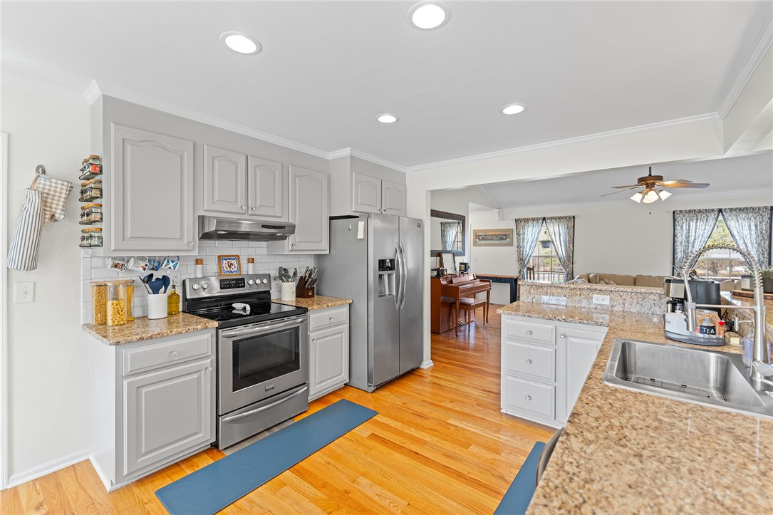 200 Poore Road Piedmont, SC 29673 - Photo 13 of 44 This open-concept kitchen features bright finishes and ample space for entertaining.