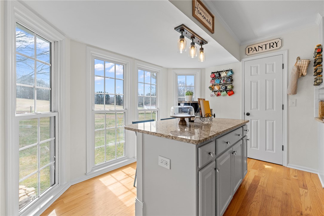 200 Poore Road Piedmont, SC 29673 - Photo 16 of 44 This bright kitchen features ample natural light, a functional island, and convenient pantry access.