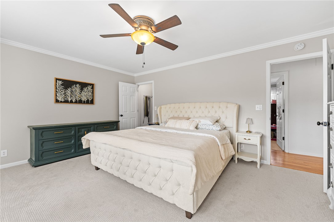 200 Poore Road Piedmont, SC 29673 - Photo 18 of 44 This restful bedroom features a ceiling fan, crown molding, and plush carpet flooring.