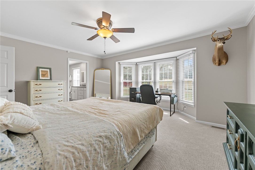 200 Poore Road Piedmont, SC 29673 - Photo 19 of 44 This cozy bedroom offers a tranquil retreat with ample natural light.