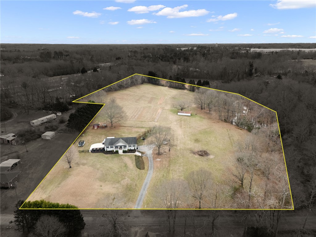 200 Poore Road Piedmont, SC 29673 - Photo 2 of 44 This expansive estate features a charming residence amidst a serene, rural setting.