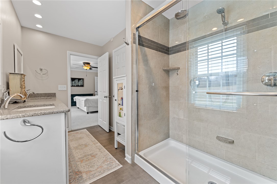 200 Poore Road Piedmont, SC 29673 - Photo 22 of 44 This primary bathroom boasts a spacious shower and a dual-sink vanity.
