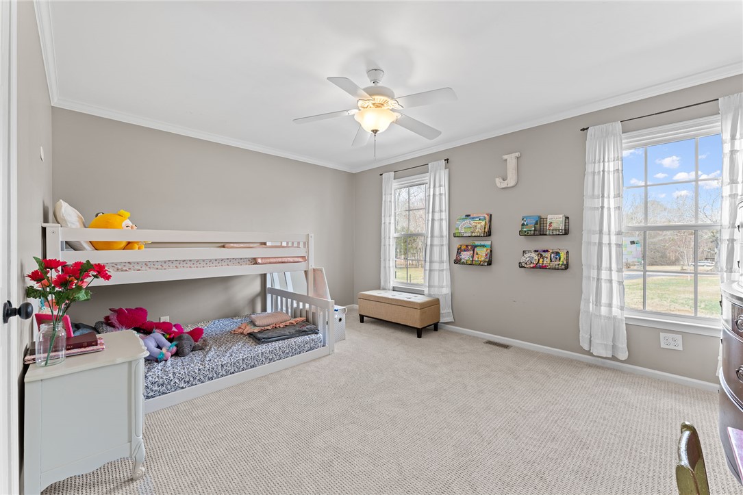 200 Poore Road Piedmont, SC 29673 - Photo 23 of 44 This cozy bedroom features plush carpet flooring and large windows that fill the space with natural light.