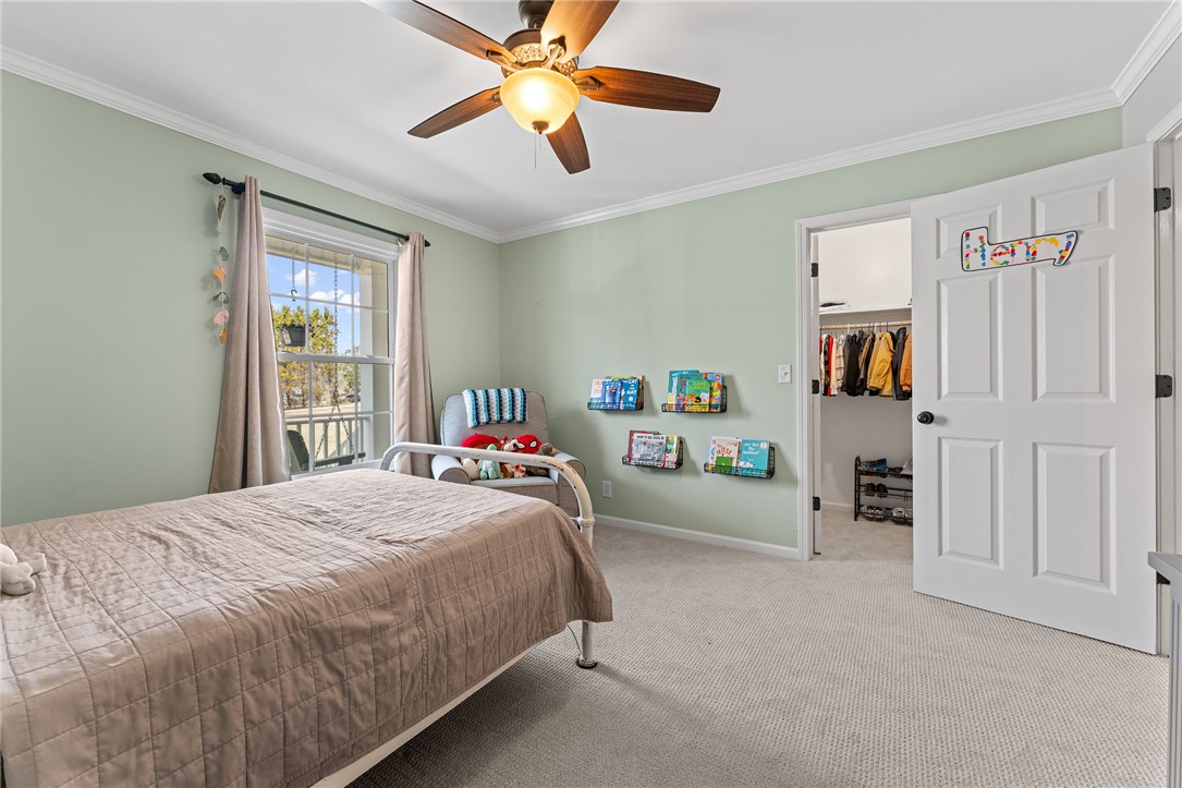 200 Poore Road Piedmont, SC 29673 - Photo 28 of 44 This cozy bedroom offers comfort and a well-organized closet, perfect for personal retreat.