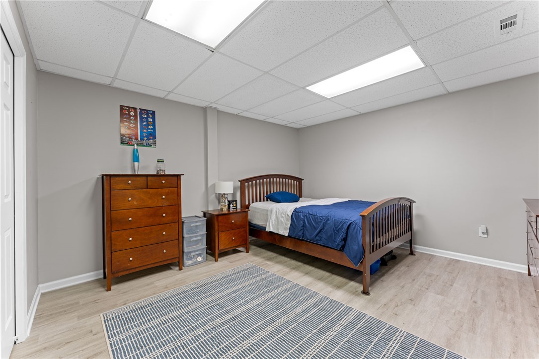 200 Poore Road Piedmont, SC 29673 - Photo 29 of 44 This cozy bedroom features light wood flooring and a classic wooden bed frame, offering comfortable living.