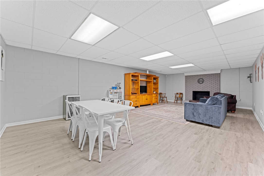200 Poore Road Piedmont, SC 29673 - Photo 31 of 44 This spacious recreational room features durable flooring and a cozy fireplace, perfect for gatherings.