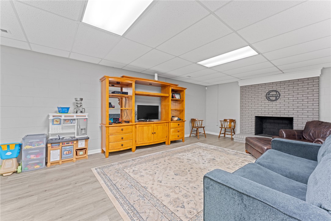 200 Poore Road Piedmont, SC 29673 - Photo 32 of 44 This versatile basement offers comfortable living with a charming brick fireplace.
