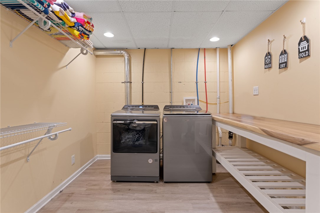 200 Poore Road Piedmont, SC 29673 - Photo 35 of 44 Functional laundry space featuring modern appliances and practical shelving.