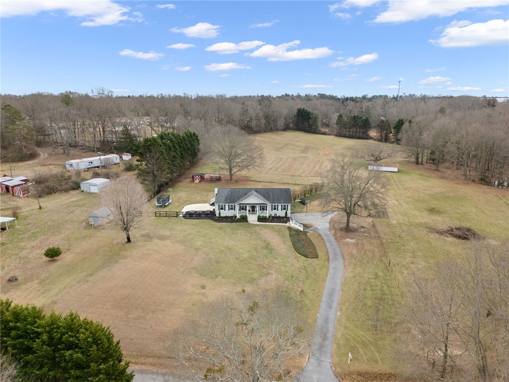 200 Poore Road Piedmont, SC 29673 - Photo 39 of 44 This expansive estate offers a charming home amidst rolling green landscapes, promising peaceful living.