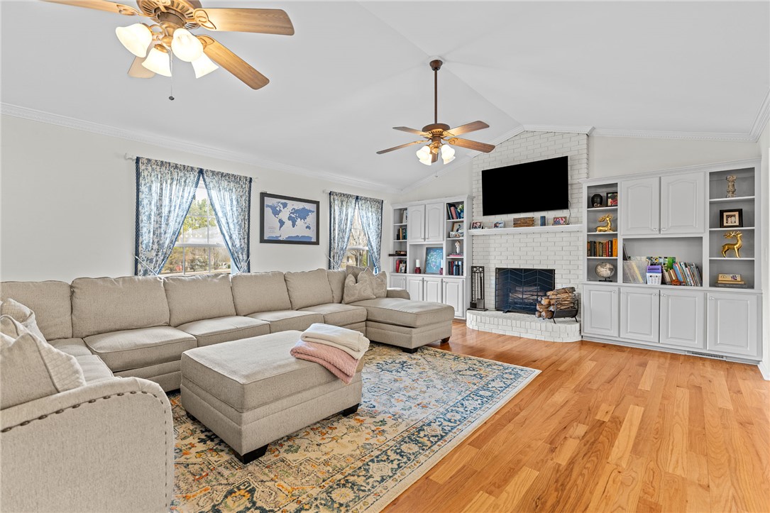 200 Poore Road Piedmont, SC 29673 - Photo 5 of 44 This inviting living area boasts rich hardwood floors and a cozy brick fireplace.