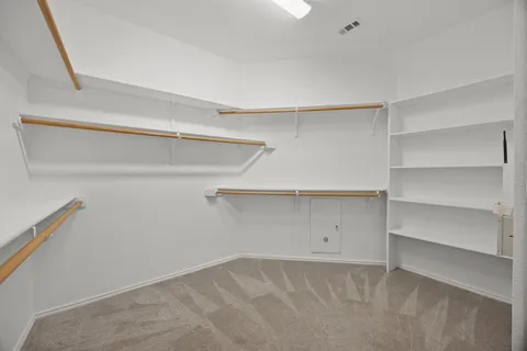 a view of an empty walk in closet
