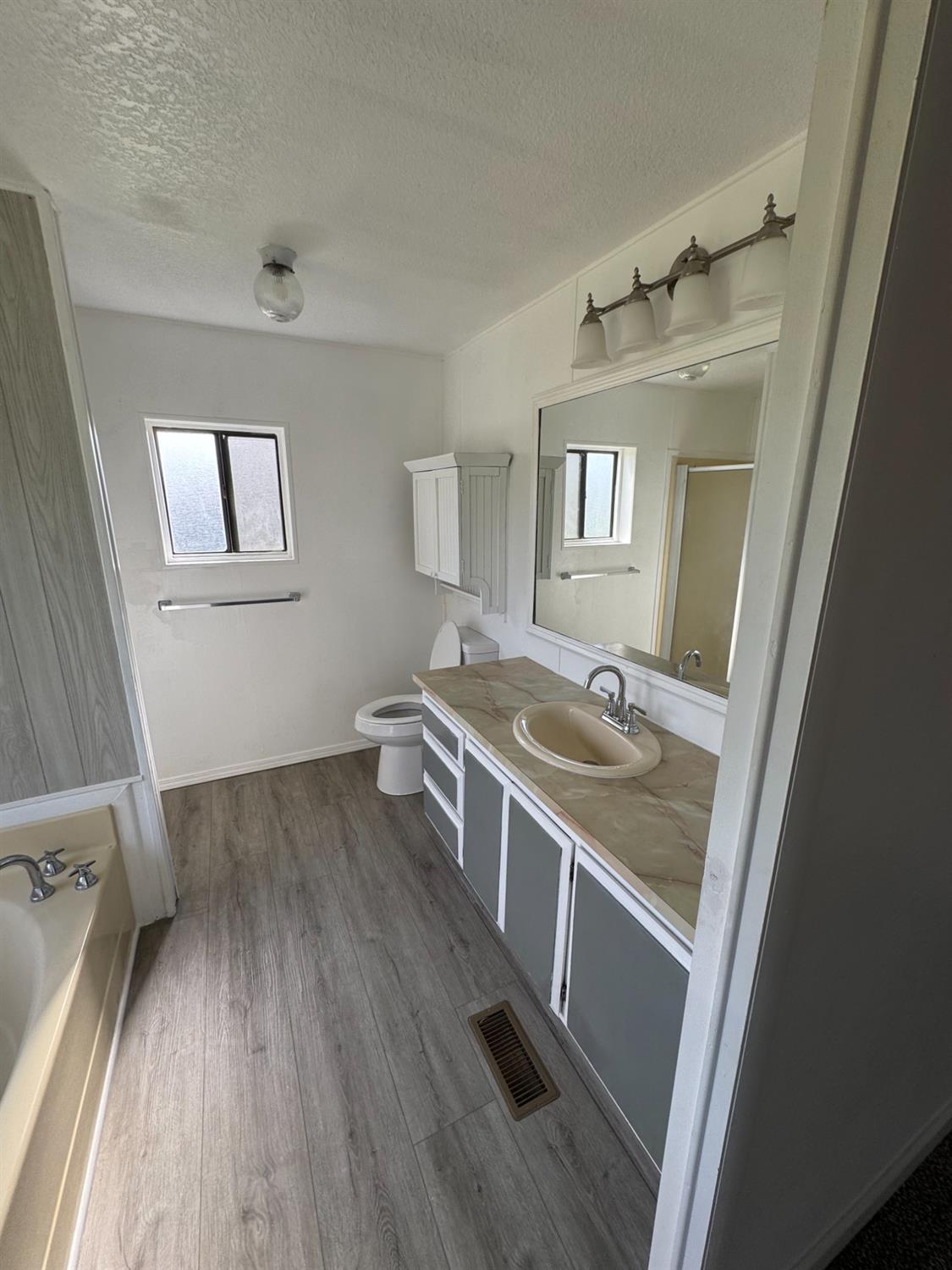 28640 Ward Street Madera, CA 93638 - Photo 20 of 31 a view of a house and wooden floor