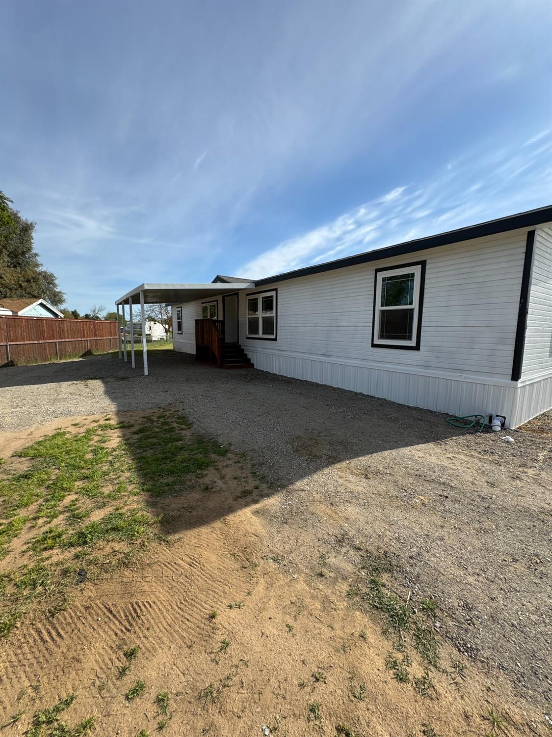 28640 Ward Street Madera, CA 93638 - Photo 25 of 31 a backyard of a house with lawn chairs