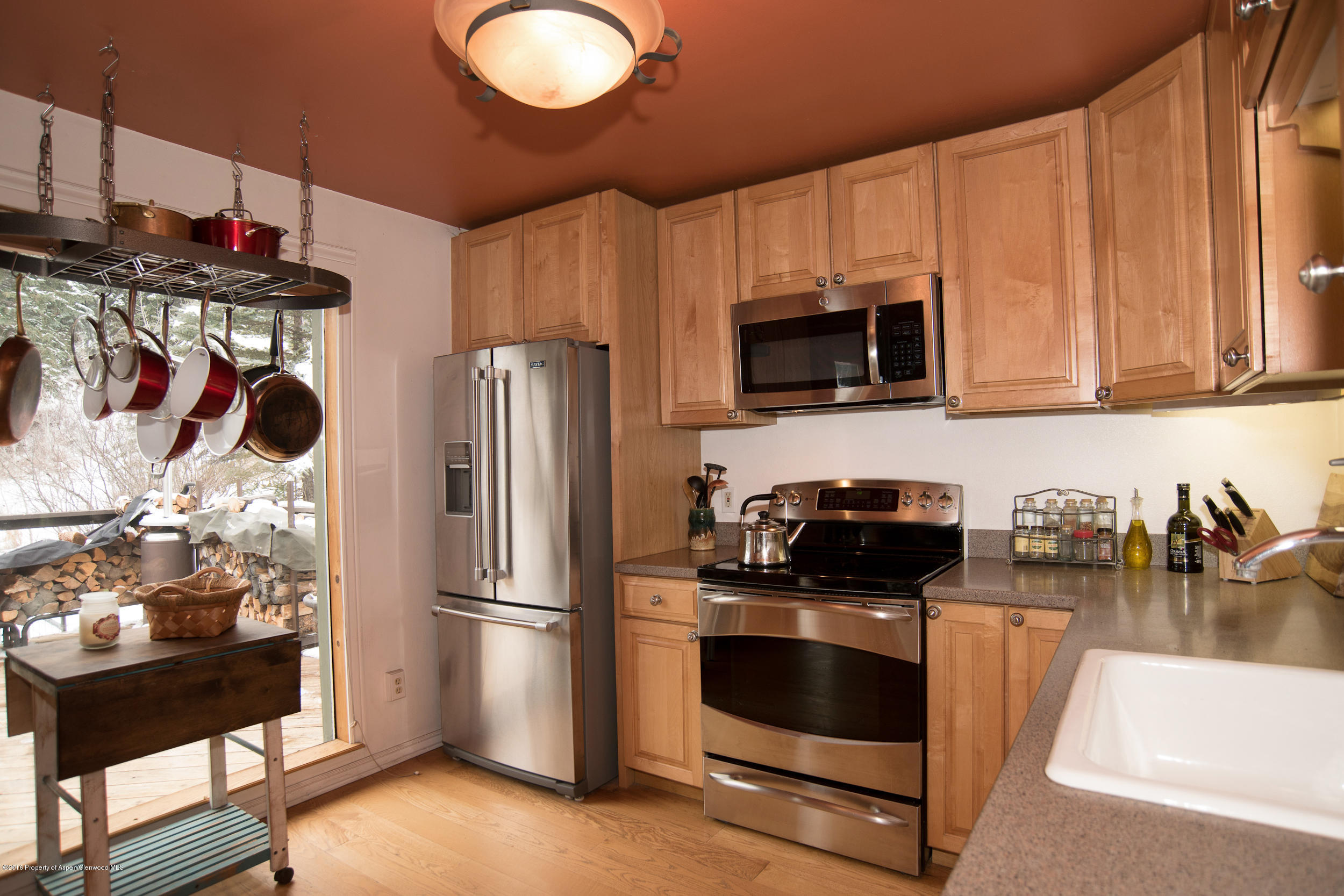 357 Elk Mountain Drive Redstone, CO 81623 - Photo 14 of 40 a kitchen with a refrigerator stove and microwave