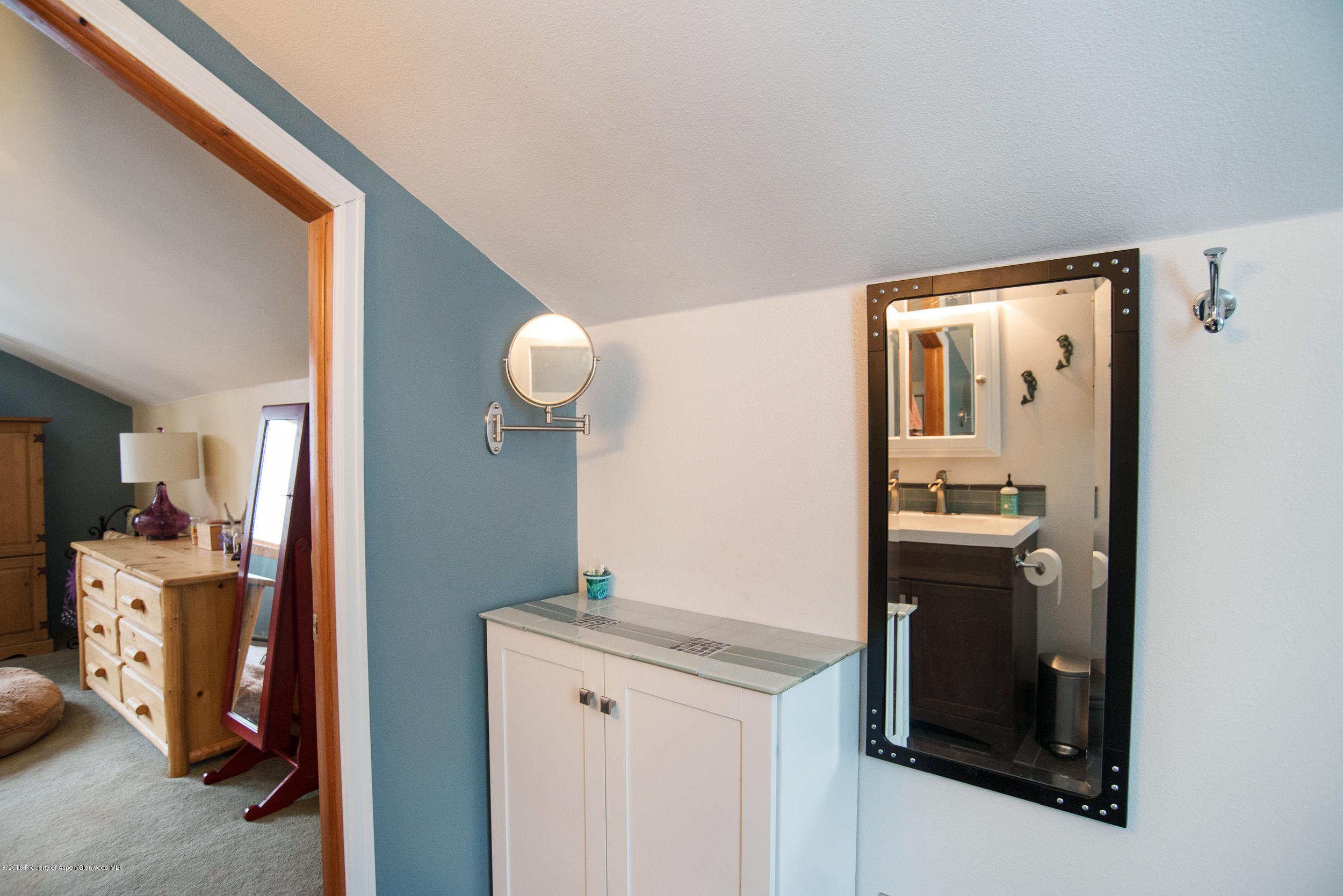 357 Elk Mountain Drive Redstone, CO 81623 - Photo 23 of 40 a view of a bathroom with a sink and mirror