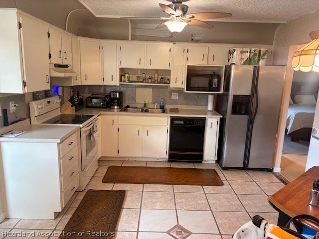 5330 Lakewood Road Sebring, FL 33875 - Photo 7 of 19 a kitchen with stainless steel appliances granite countertop a refrigerator a stove and white cabinets