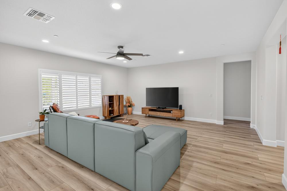7605 Ferrell Way Elk Grove, CA 95757 - Photo 11 of 69 a living room with furniture and a flat screen tv