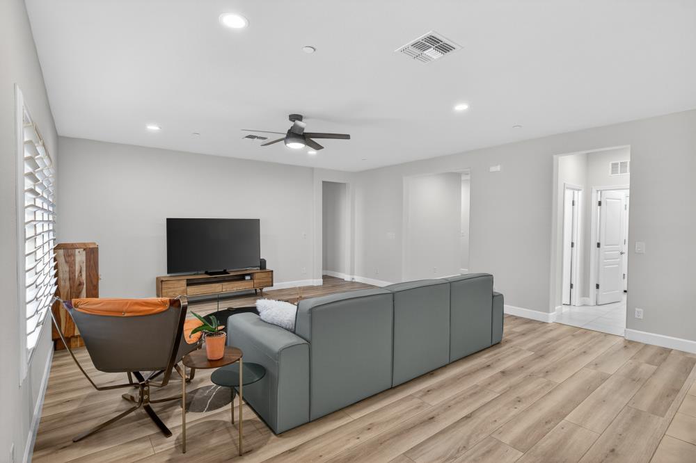 7605 Ferrell Way Elk Grove, CA 95757 - Photo 12 of 69 a living room with furniture and a flat screen tv