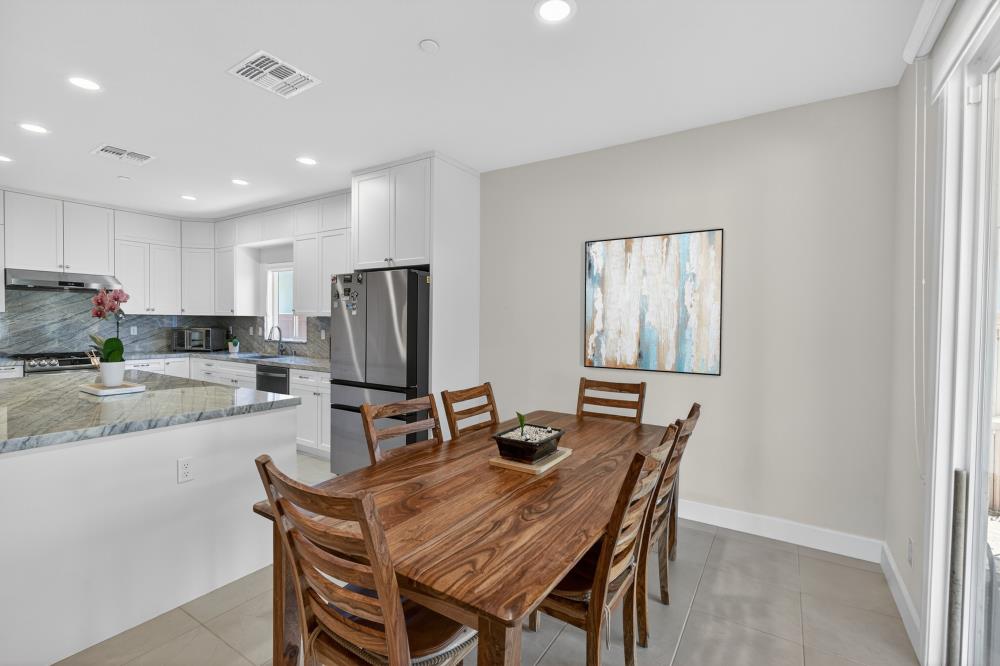 7605 Ferrell Way Elk Grove, CA 95757 - Photo 14 of 69 a dining room with furniture and window