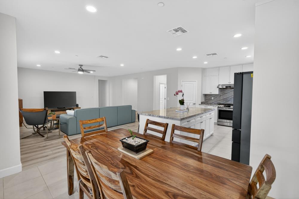 7605 Ferrell Way Elk Grove, CA 95757 - Photo 16 of 69 a living room with furniture and a flat screen tv