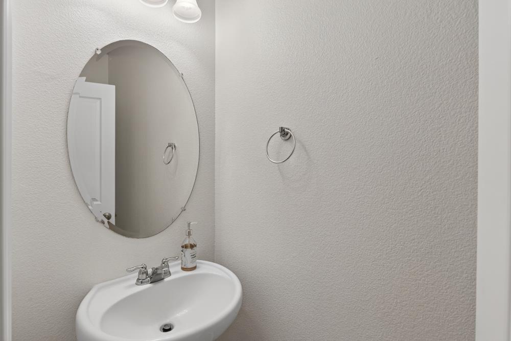 7605 Ferrell Way Elk Grove, CA 95757 - Photo 29 of 69 a bathroom with a sink and a mirror