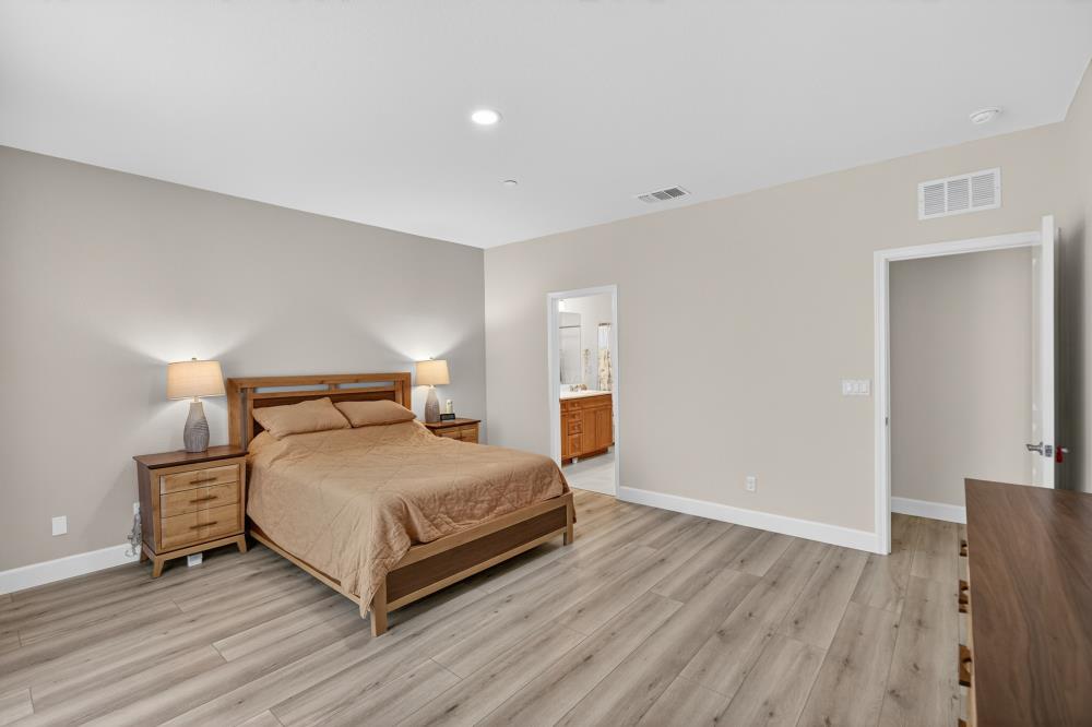 7605 Ferrell Way Elk Grove, CA 95757 - Photo 32 of 69 a bedroom with a bed and a night stand