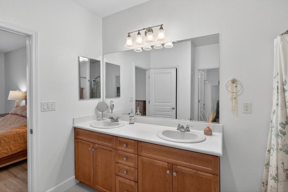 7605 Ferrell Way Elk Grove, CA 95757 - Photo 37 of 69 a bathroom with a sink double vanity and a mirror