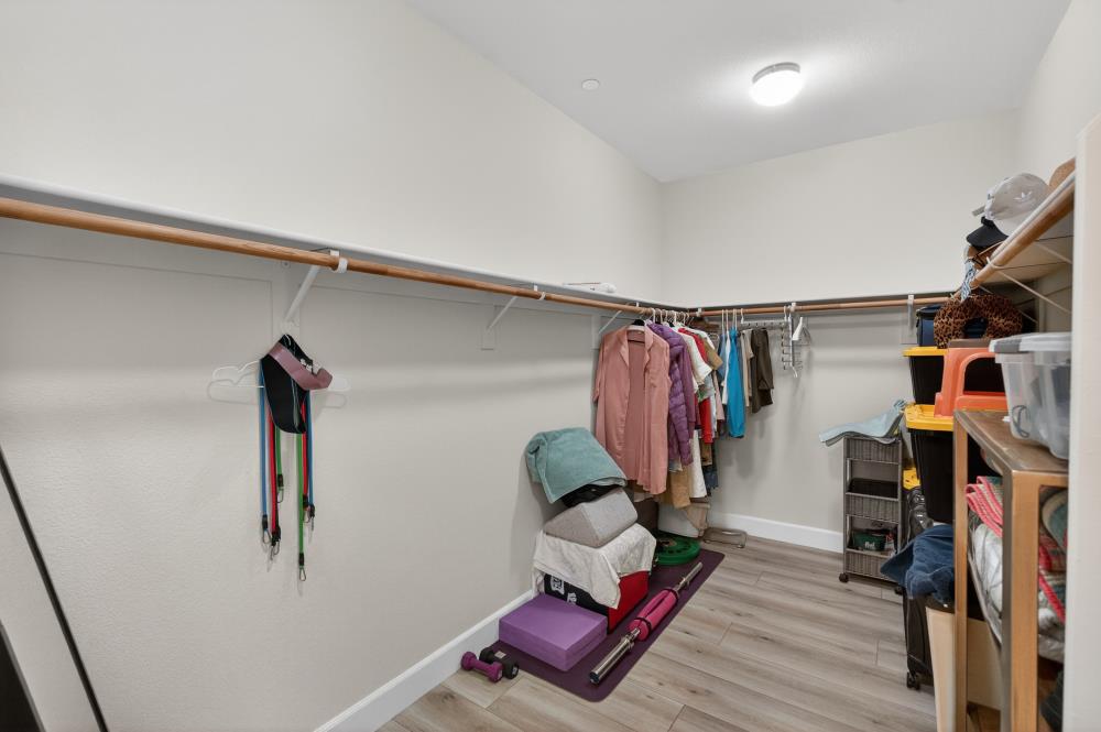 7605 Ferrell Way Elk Grove, CA 95757 - Photo 38 of 69 a view of walk in closet with clothes and shoes