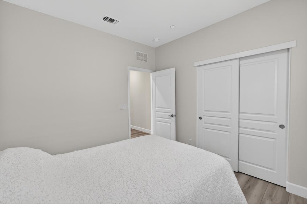 7605 Ferrell Way Elk Grove, CA 95757 - Photo 40 of 69 a bedroom with a bed and cabinets