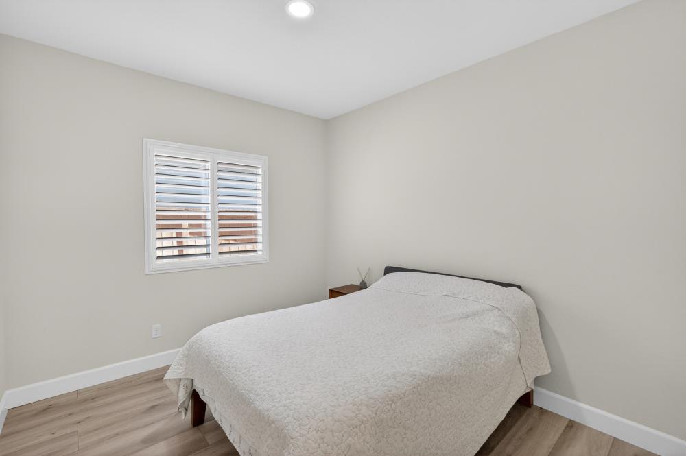 7605 Ferrell Way Elk Grove, CA 95757 - Photo 41 of 69 a bed sitting in a bedroom next to a window