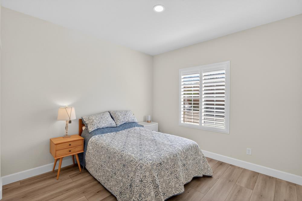 7605 Ferrell Way Elk Grove, CA 95757 - Photo 42 of 69 a bedroom with a bed and wooden floor