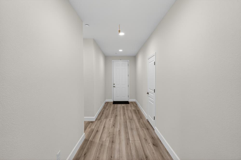 7605 Ferrell Way Elk Grove, CA 95757 - Photo 47 of 69 a view of a hallway with wooden floor