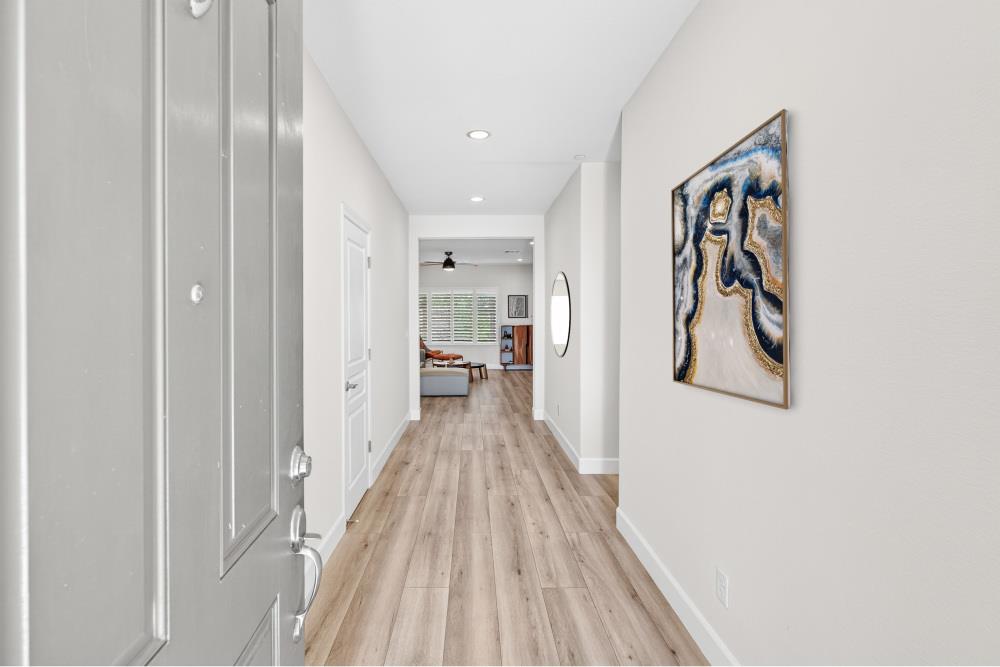 7605 Ferrell Way Elk Grove, CA 95757 - Photo 5 of 69 a view of a hallway with wooden floor and entryway