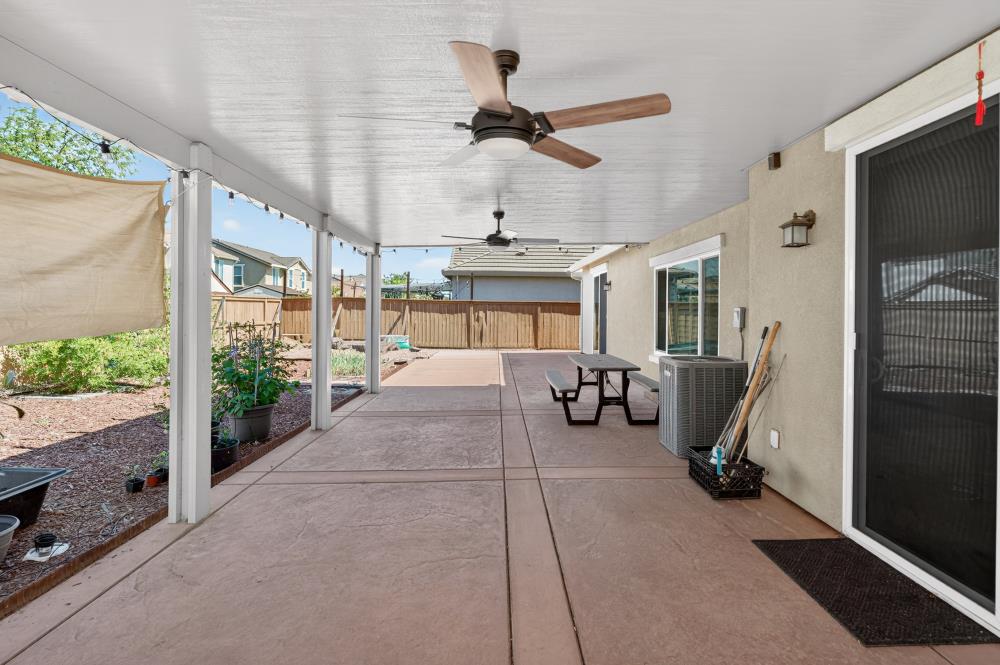 7605 Ferrell Way Elk Grove, CA 95757 - Photo 60 of 69 a very nice looking room with a large window and a chandelier