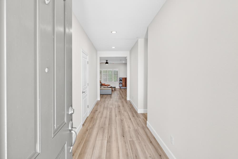 7605 Ferrell Way Elk Grove, CA 95757 - Photo 6 of 69 a view of a hallway with wooden floor and staircase