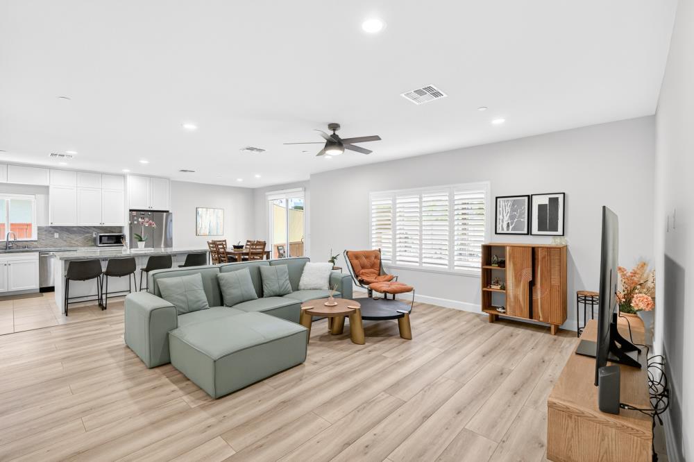 7605 Ferrell Way Elk Grove, CA 95757 - Photo 7 of 69 a living room with furniture and a flat screen tv