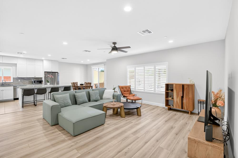 7605 Ferrell Way Elk Grove, CA 95757 - Photo 8 of 69 a living room with furniture and a flat screen tv