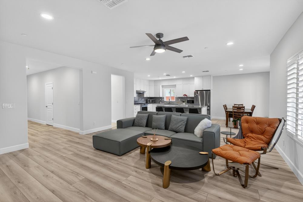 7605 Ferrell Way Elk Grove, CA 95757 - Photo 9 of 69 a living room with furniture or kitchen view and a wooden floor