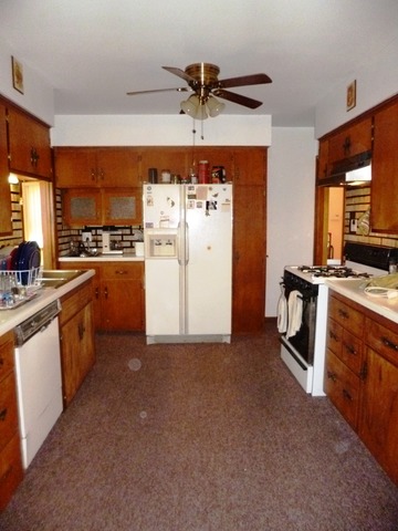 1802 Evergreen Road Homewood, IL 60430 - Photo 3 of 23 a kitchen with stainless steel appliances a stove a refrigerator and a sink