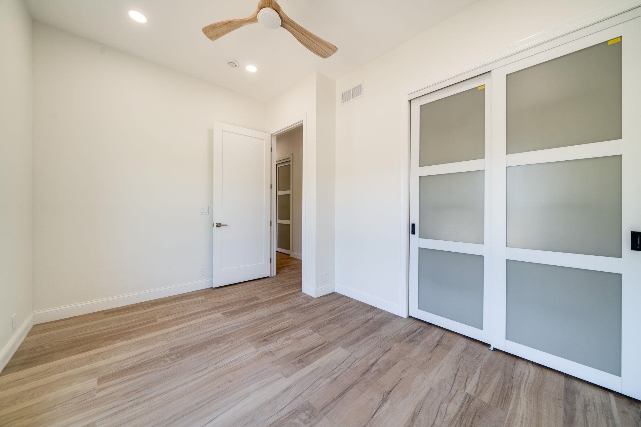 5145 Sycamore Ridge Road Belvidere, IL 61008 - Photo 30 of 57 an empty room with wooden floor and windows