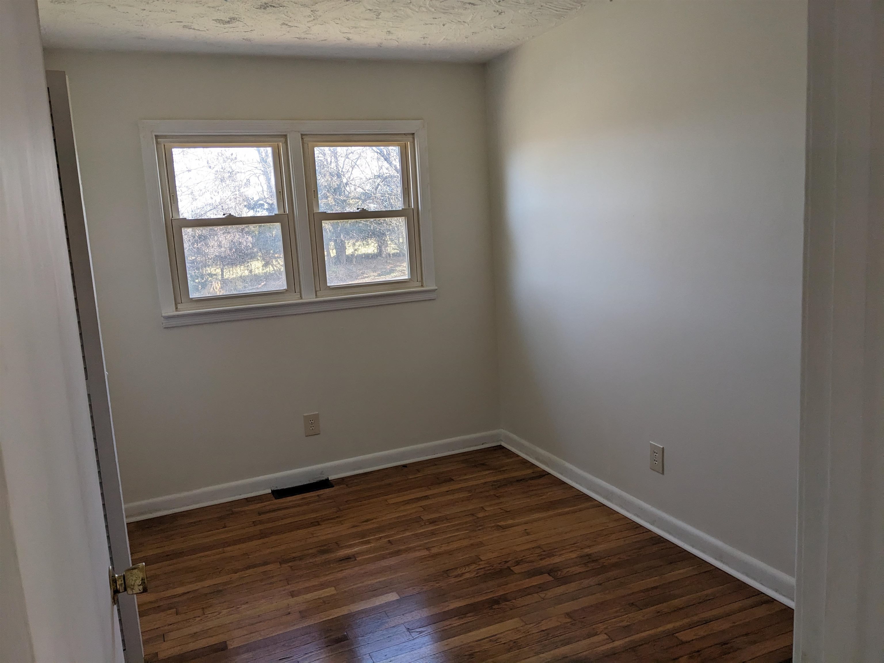 2559 River Road New Market, VA 22844 - Photo 6 of 19 an empty room with wooden floor and windows