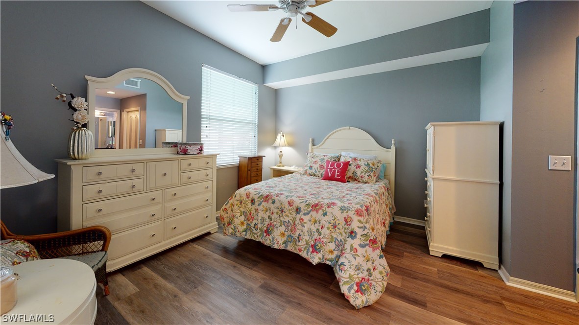 14111 Brant Point Circle, Unit 2201 Fort Myers, FL 33919 - Photo 15 of 30 a bedroom with a bed and a dresser